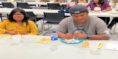 Dad and daughter playing Bingo for Books