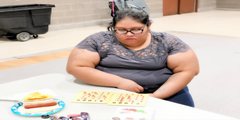 Parent Playing Bingo for Books